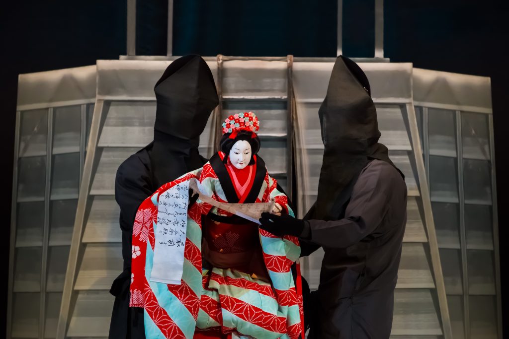 The art of Bunraku or Japanese puppet theatre requires three puppeteers to bring the dolls to life.
