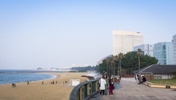 Fukuoka, Japan - March 19, 2016: Tourists are taking picture on the beachside walk of seaside momochi park.