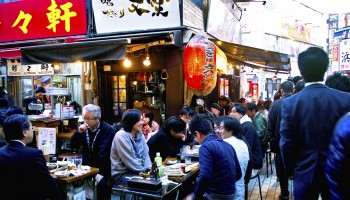 People eating and drinking in an izakaya in Ameya-yokocho, Taito-ku, Tokyo