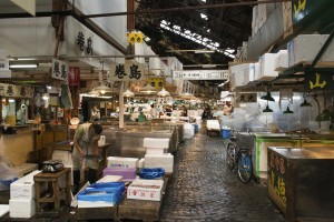Tokyo, Japan - June 4, 2015: Retailers busy selling and packing seafood in Tsukiji market. It is the largest fish market in Japan.